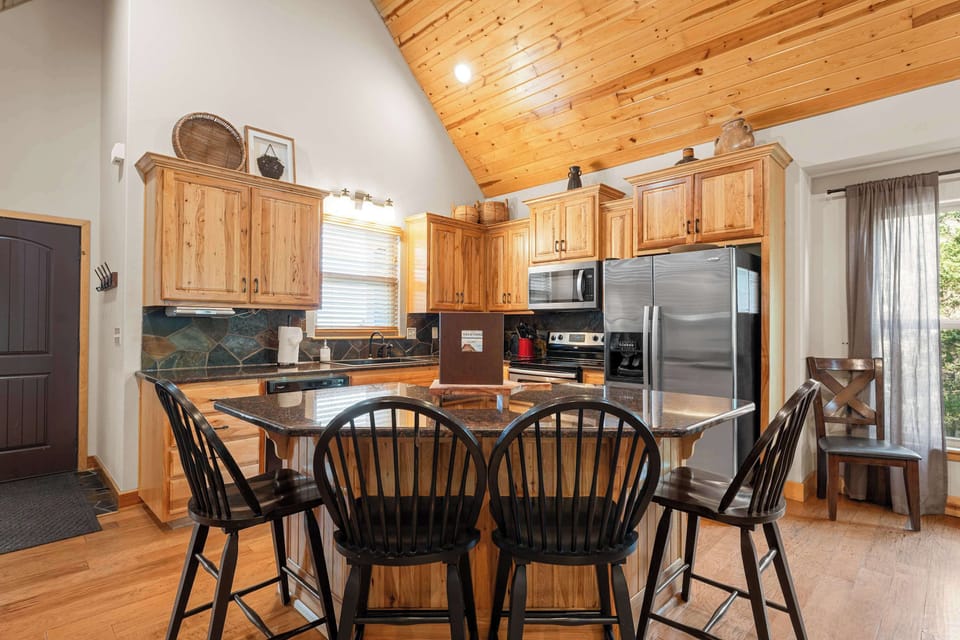 Additional seating around the island makes for the perfect place to gather for morning coffee