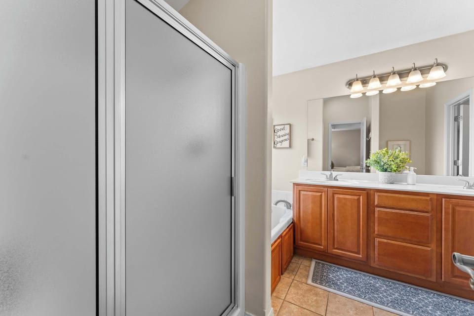 The Master Bathroom has a shower, tub, and a double vanity