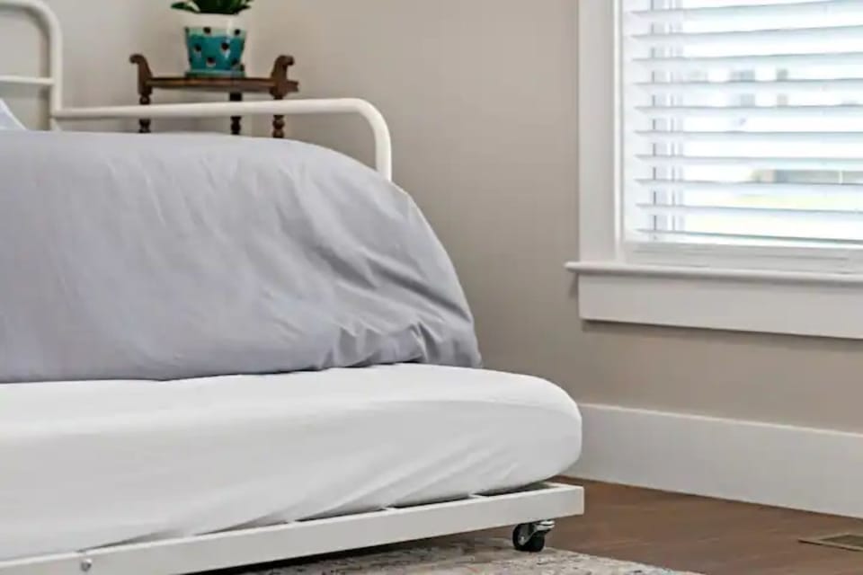 Trundle bed rolls out from under the twin daybed.