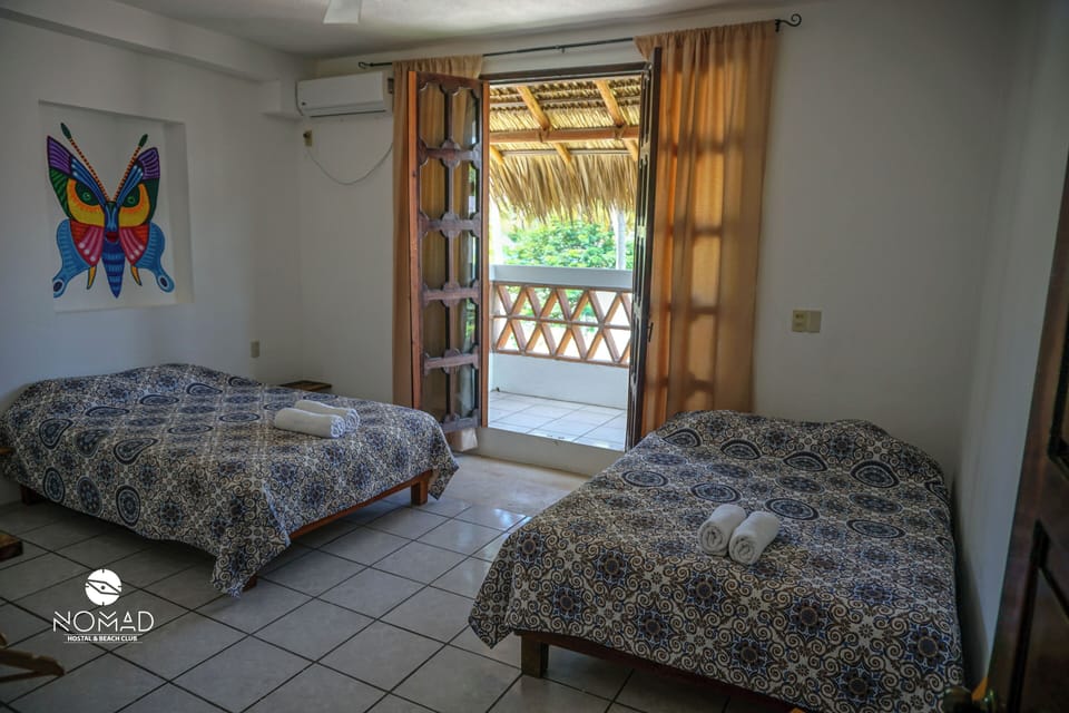 Superior Quadruple Room, 2 Queen Beds, Partial Ocean View, Beachside | Iron/ironing board, free WiFi, bed sheets