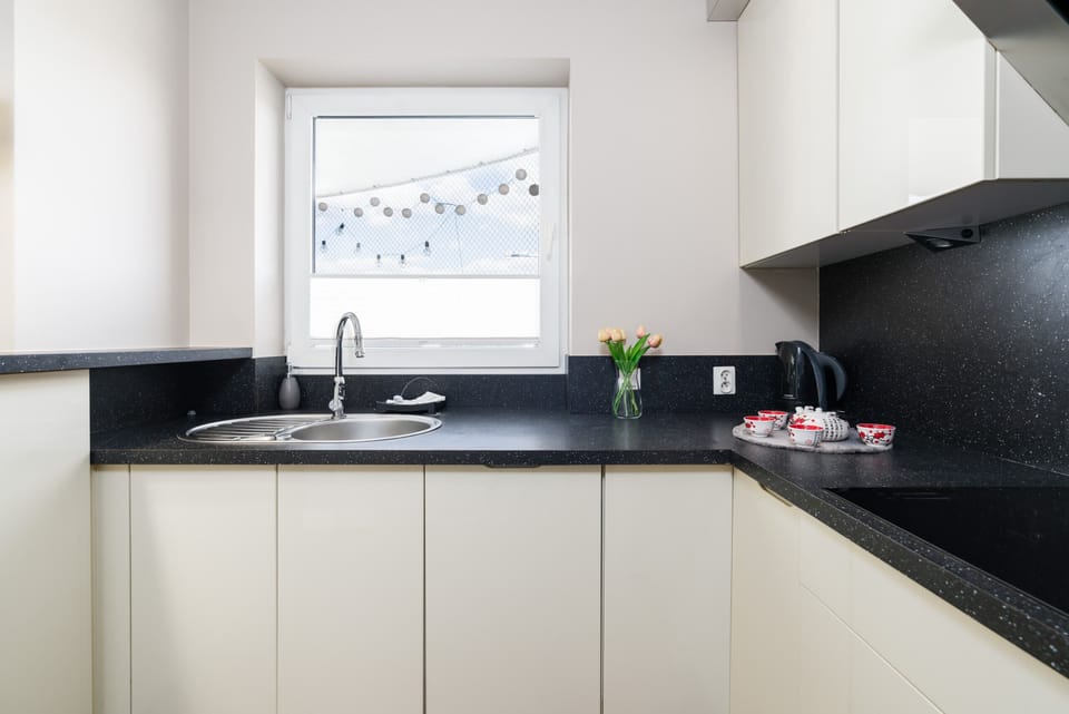 The kitchenette's practical layout maximizes space and functionality.