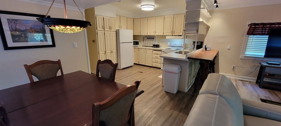 Kitchen & Dining Area - Complete full kitchen and modern refrigerator.