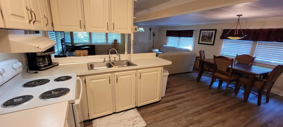 Kitchen - Main Level - Complete full kitchen and modern refrigerator.