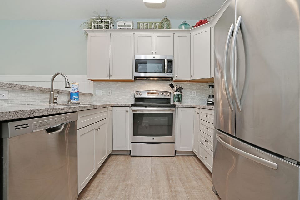 Your fully equipped kitchen features stainless steel appliances and granite countertops, perfect for preparing meals during your stay.