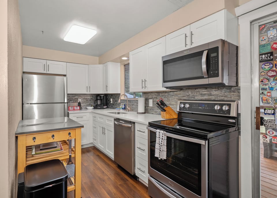 Bright modern kitchen with stainless appliances and great prep space