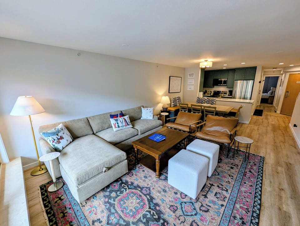Sink into the plush sectional and enjoy the open, inviting space where you can relax, dine, and unwind—perfectly designed for your comfort and memorable moments.