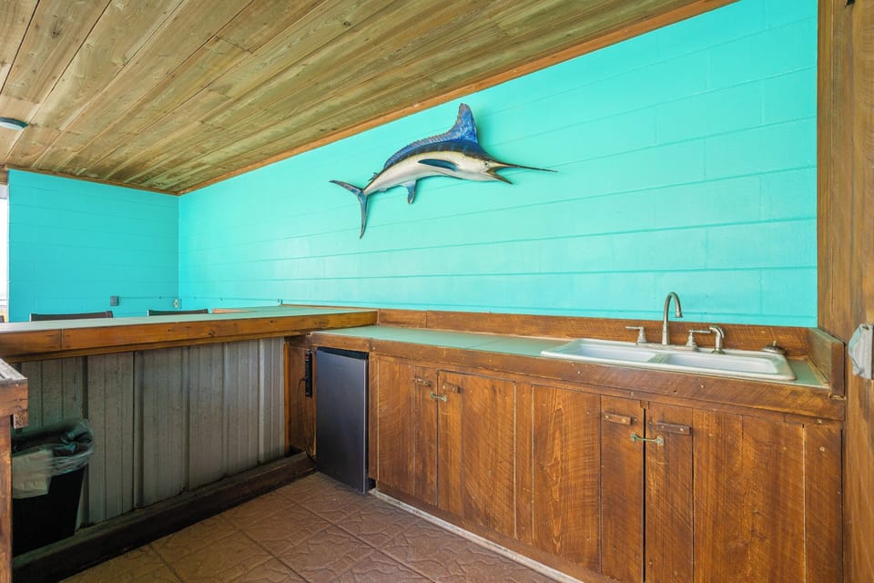Includes sink, mini-fridge, and propane grill
