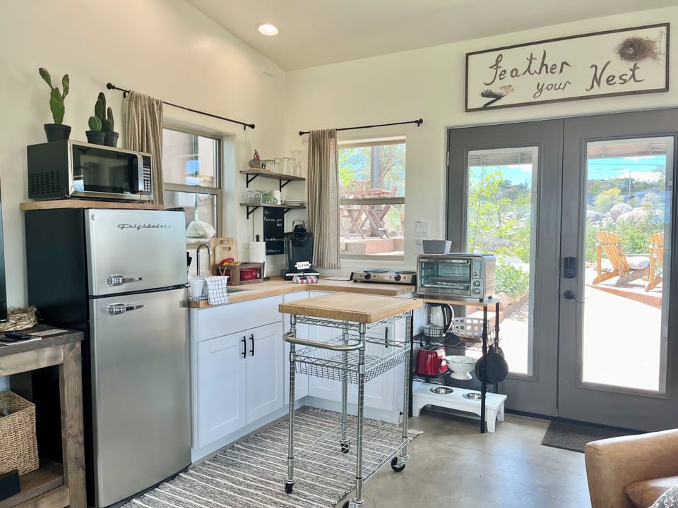 Kitchen: fridge/freeze, micro, toaster, 2 burner stove, oven & coffee options