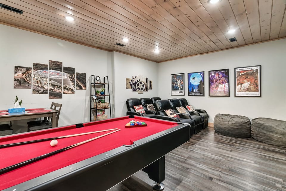 Theater Room: Movie marathons await in this vibrant space with a pool table and plush seating!