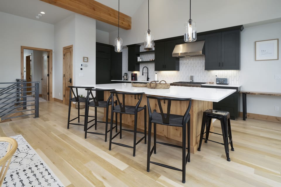 The Kitchen showing the island, range, fridge and seating areas