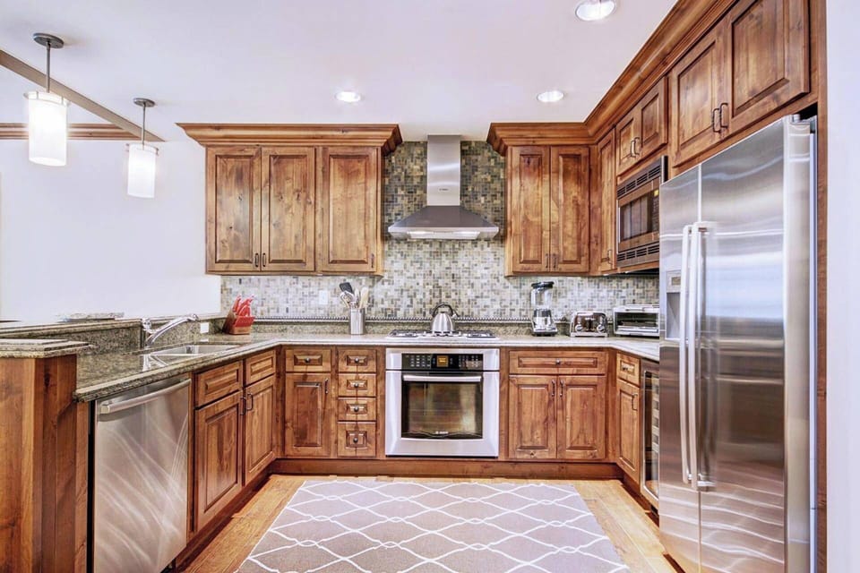 Gourmet Kitchen features premium stainless steel appliances.