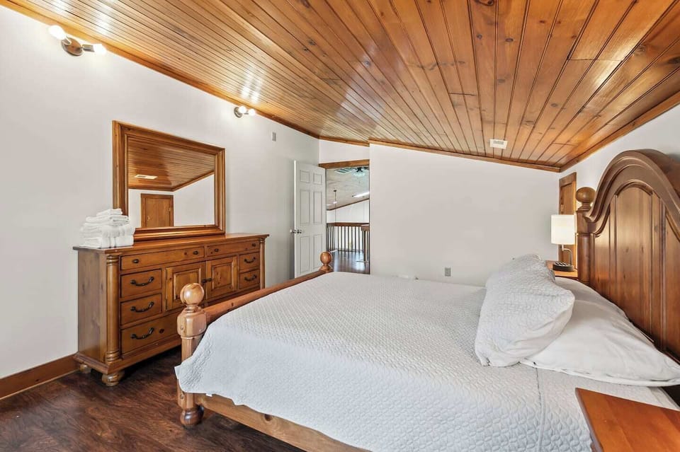 Third bedroom with massive queen post bed.