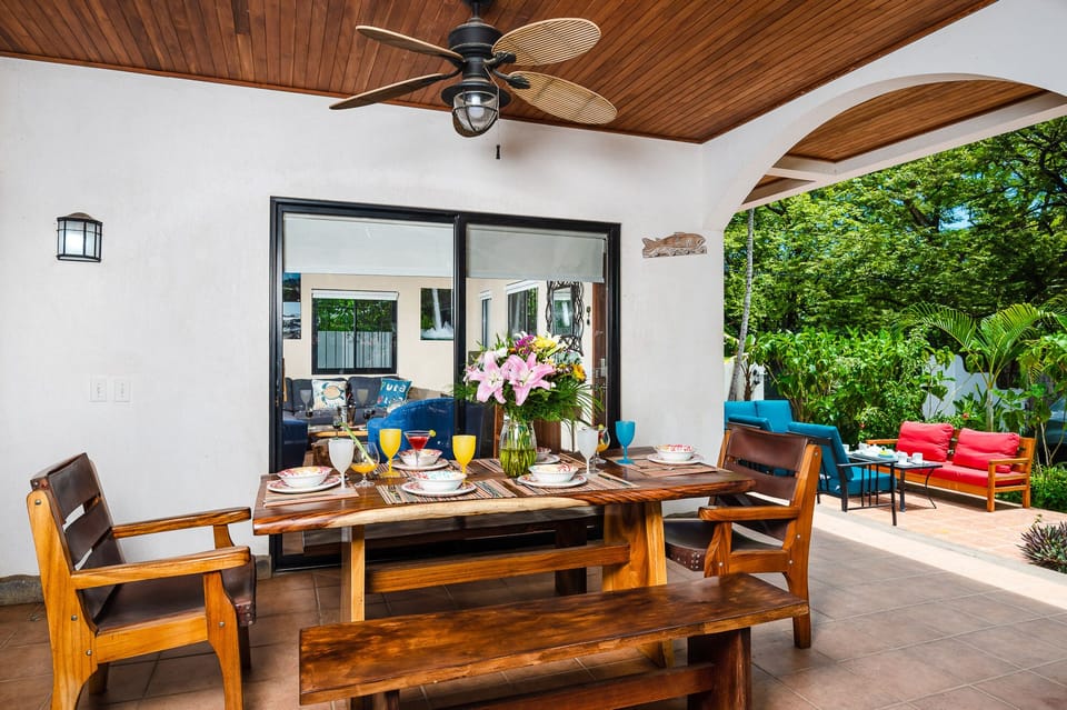 Dine al fresco at the stylish wooden outdoor table, perfect for enjoying Costa Rica’s warm weather and memorable moments near Tamarindo Beach.