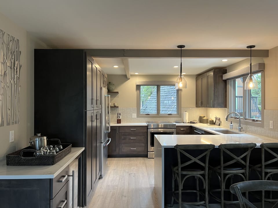 Kitchen with bar and separate wine/drink cooler
