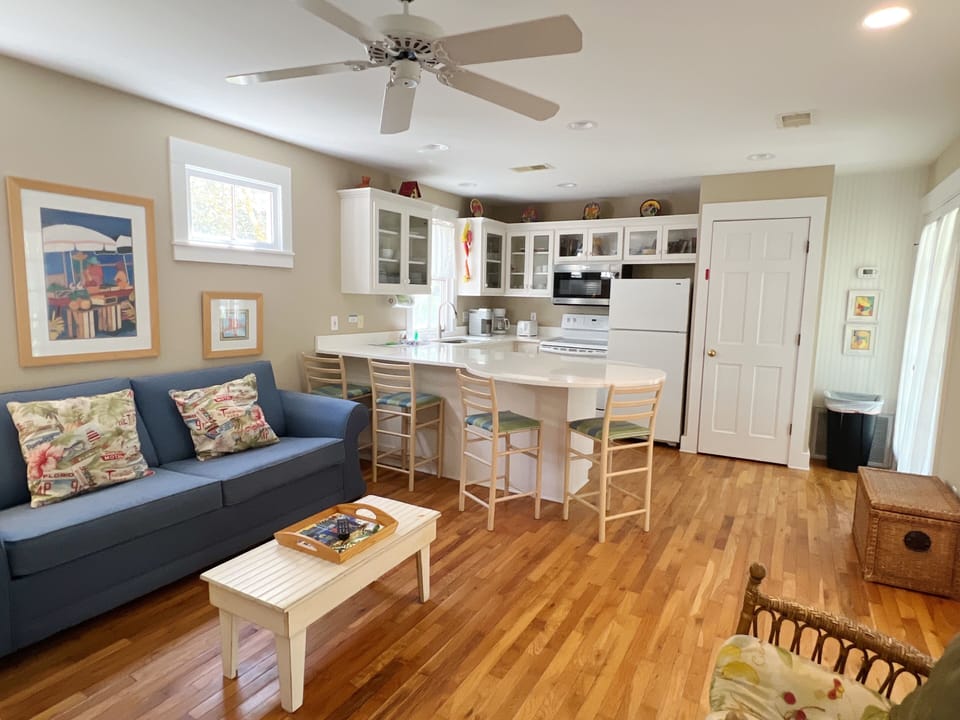 OPEN LIVING ON FIRST STORY FACING FULLY EQUIPPED KITCHEN