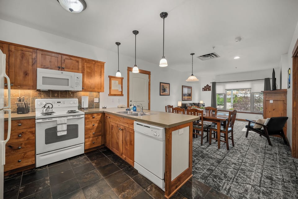 Open kitchen and dining area with island and patio access