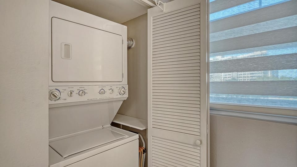 Convenient laundry nook with stacked washer and dryer