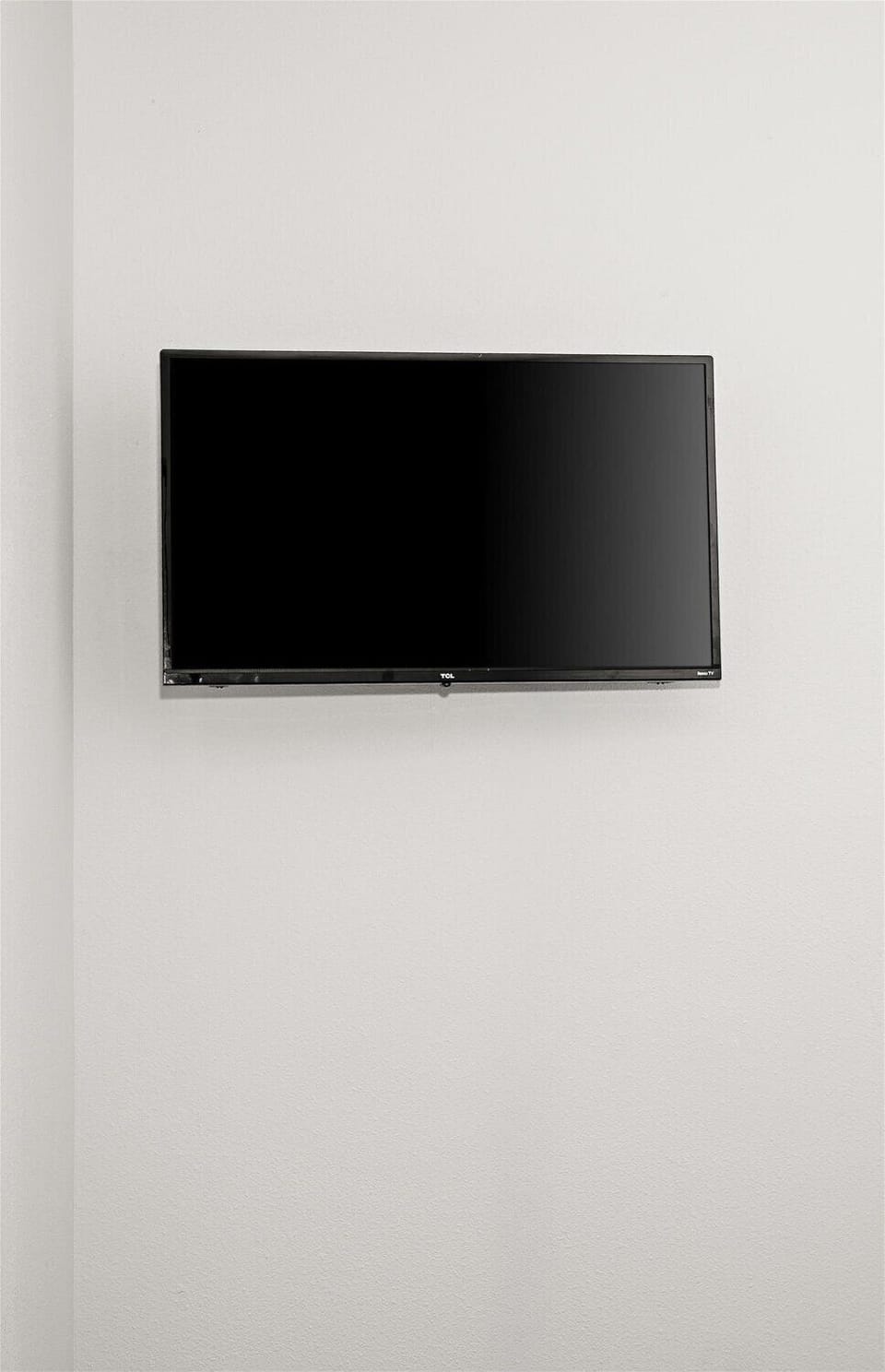 Wall-mounted flat-screen TV for easy, space-saving guest entertainment