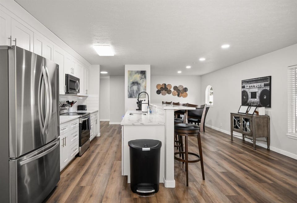Bright modern kitchen with island seating and open dining space