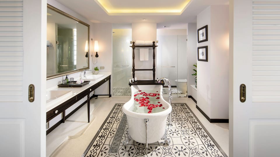 Grand Suite | Bathroom | Separate tub and shower, rainfall showerhead, designer toiletries