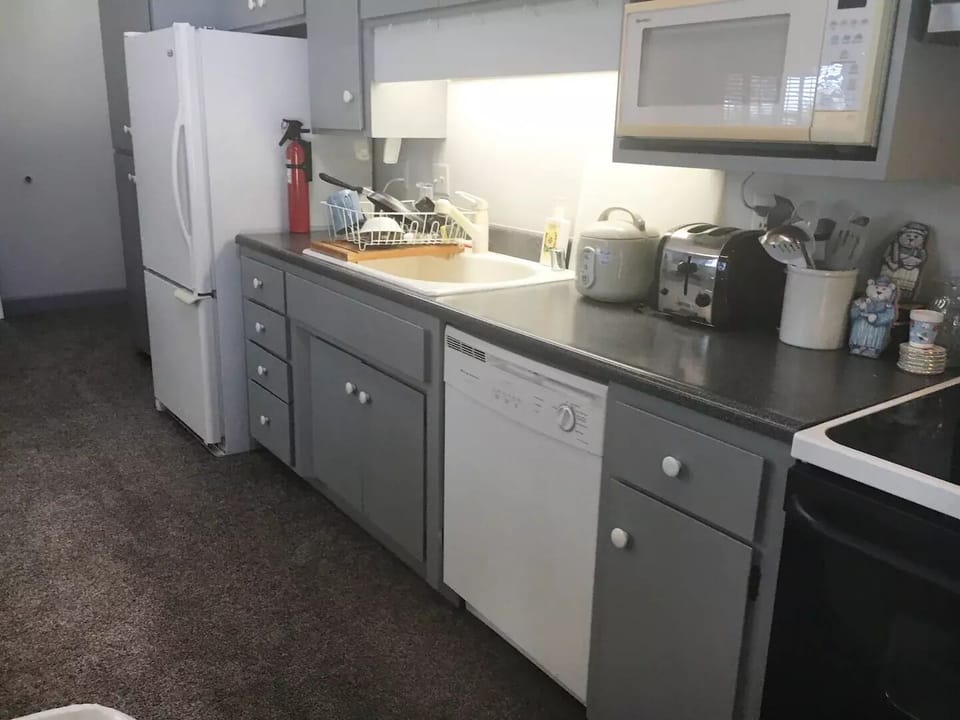 The kitchen also has a dishwasher, range, oven, microwave, toaster, Keurig, etc.