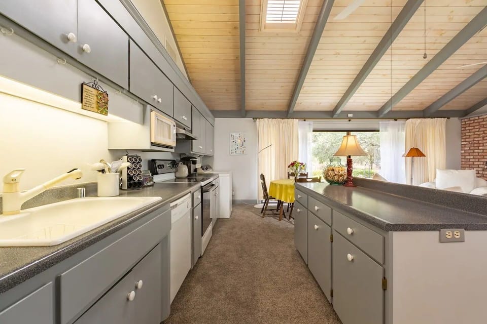 Kitchen, dining area, and sliding glass doors that lead to your patio.
