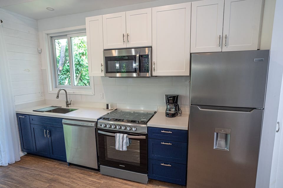 Kitchen includes dishwasher, microwave, oven and fridge w/ fresh water dispenser