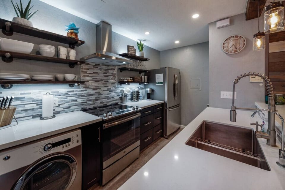 Kitchen equipped with small washer and dryer (Note: Kitchen has a standard drip coffee maker)