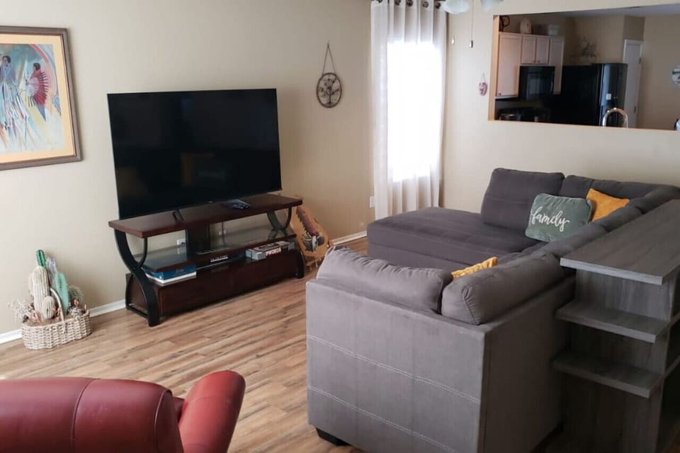 Living room with plenty of comfortable seating  and smart TV