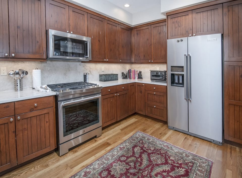 Condo, 4 Bedrooms | Private kitchen | Fridge, oven, coffee/tea maker, toaster