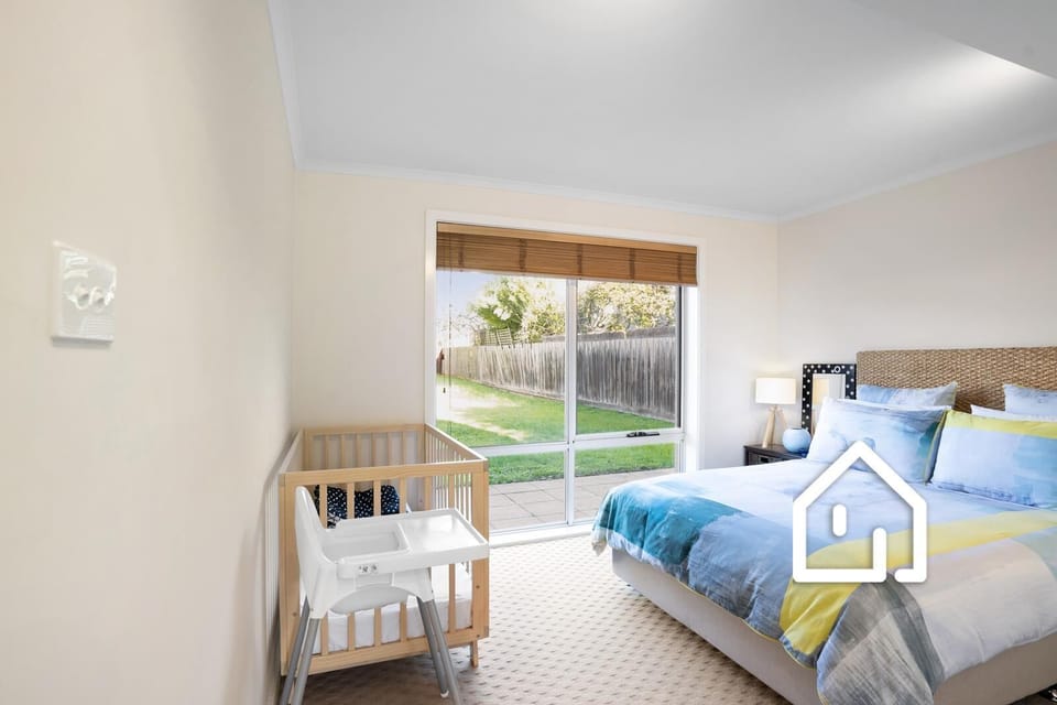 Bedroom 4 (downstairs) with queen bed and cot