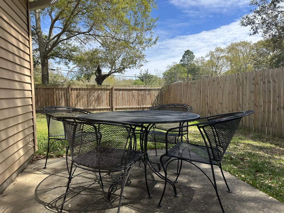 Fenced in backyard and seating