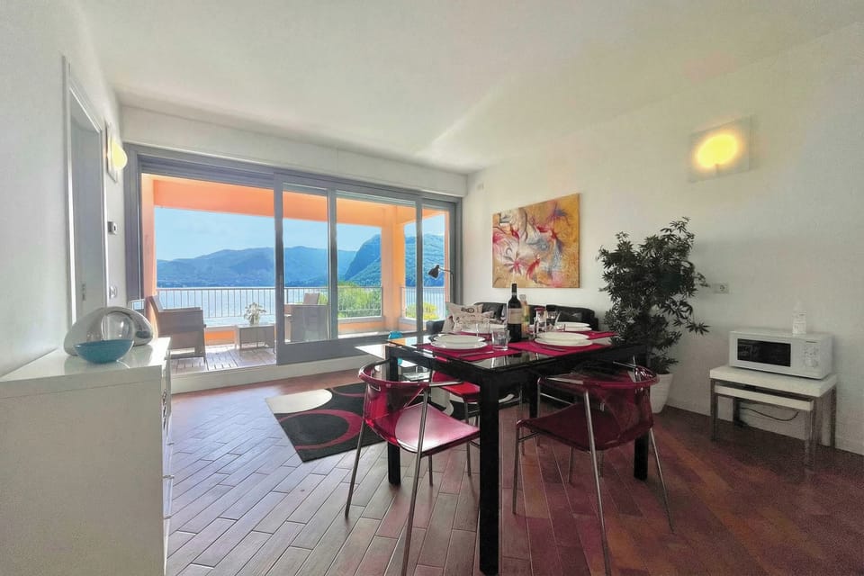 Open plan dining living room area with view of the lake