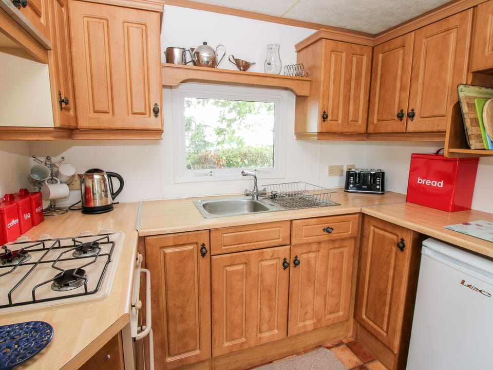 Fridge, electric kettle, toaster, cookware/dishes/utensils
