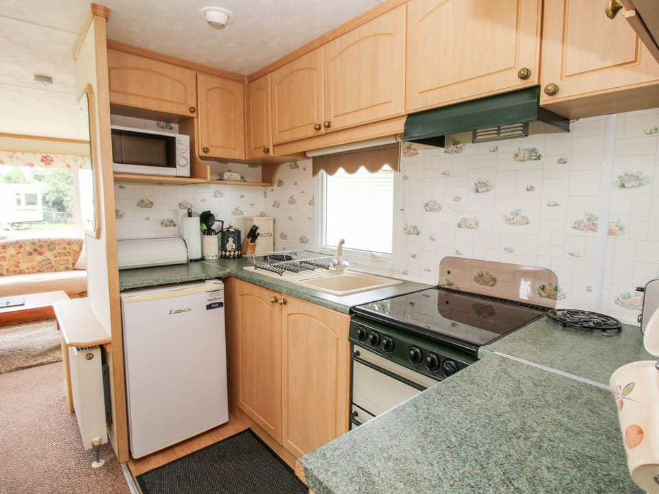 Fridge, electric kettle, toaster, cookware/dishes/utensils