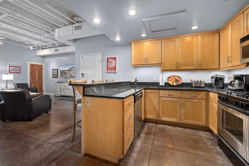 Spacious kitchen with modern appliances and open living area