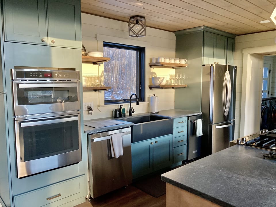 Full kitchen with wall oven/microwave combo, dishwasher, ice maker and fridge.