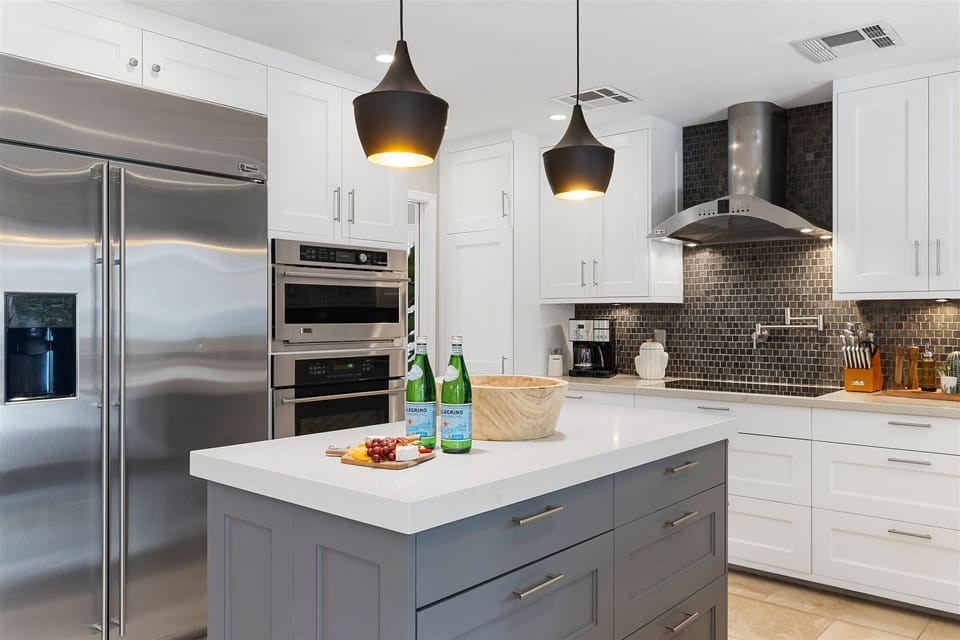 Fully equipped modern kitchen stocked with amenities for an easy stay.