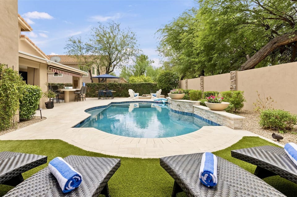 Poolside loungers, AZ Sunshine, pool fountains, spacious outdoor gathering areas
