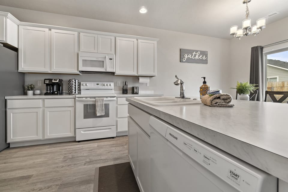 The kitchen features a lot of counter space, perfect for bigger meals or working remotely!
