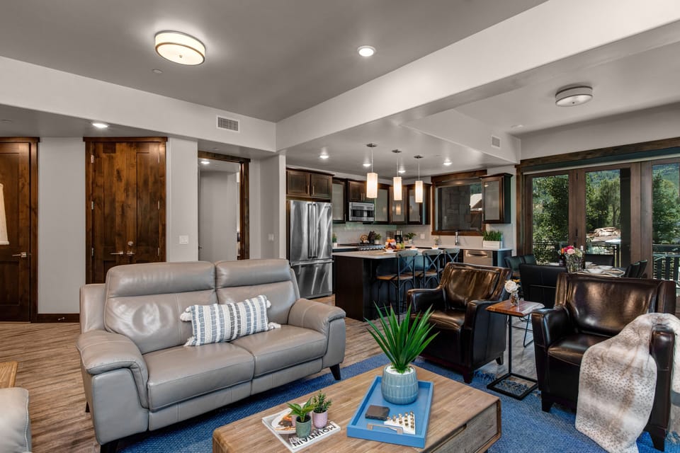 Living Room with smart TV, gas fireplace, and private deck access
