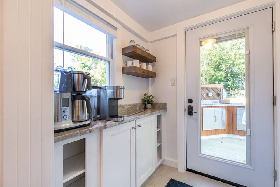 The kitchen's butler pantry is also a coffee bar with 2 coffee makers.
