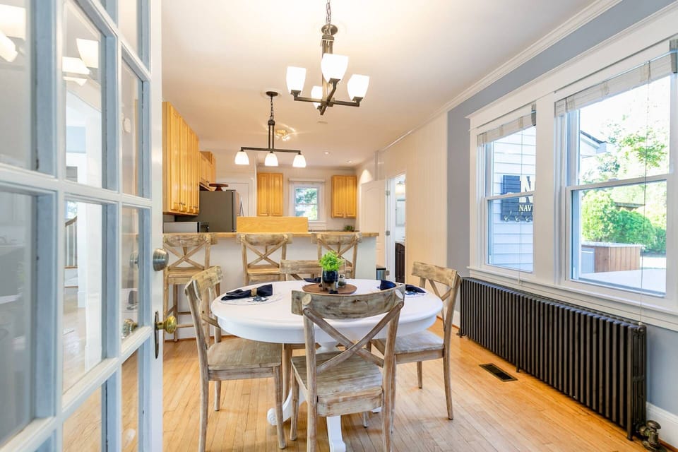 The table in the sunny dining room overlooking the backyard seats 4.