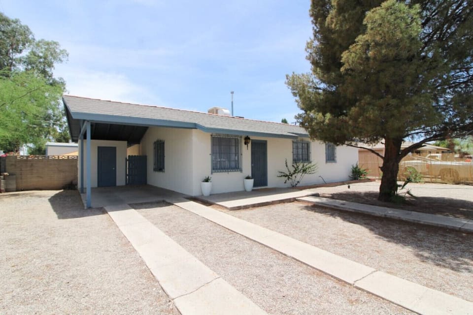Front view of home with covered carport parking