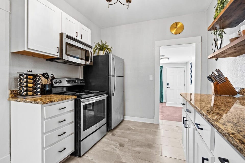 Kitchen: Modern appliances and sleek counters invite culinary adventures in this stylish space!