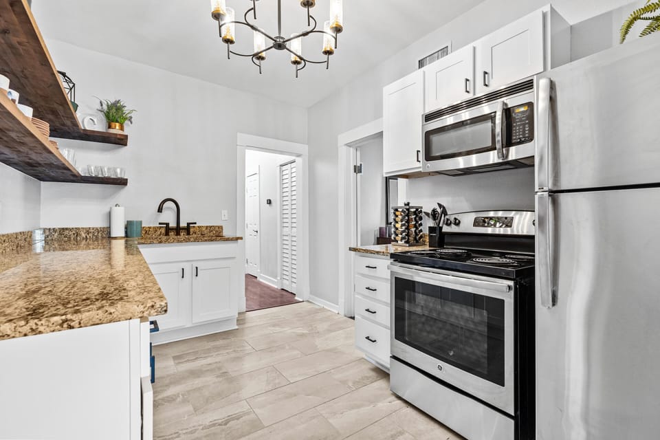 Kitchen: Modern appliances and sleek counters invite culinary adventures in this stylish space!
