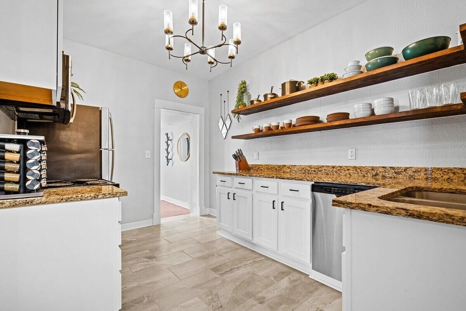 Kitchen: Modern appliances and sleek counters invite culinary adventures in this stylish space!