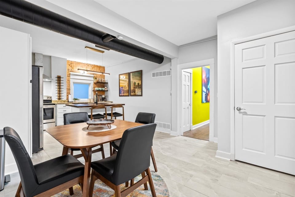 Remodeled kitchen features bar seating and an eat-in table for four