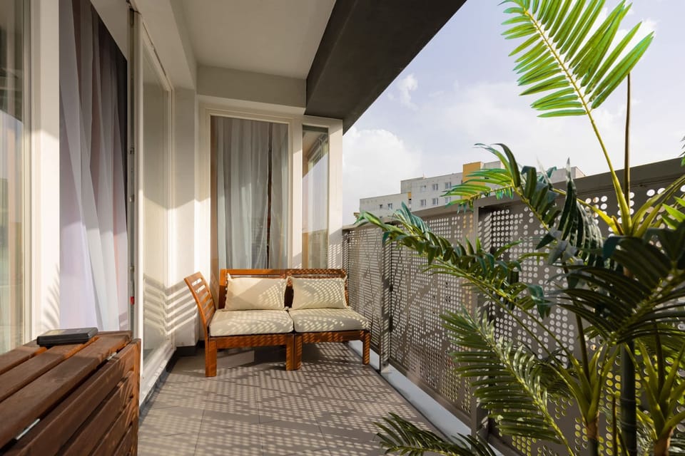 The balcony provides a perfect spot for enjoying the fresh air. 