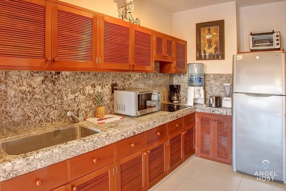 Cook up your favorite meals in this spacious, fully equipped kitchen with all the essentials.